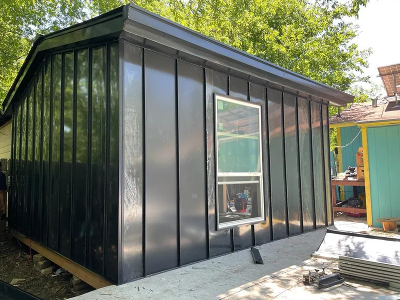 Black standing seam metal wall panels for Roof Inspection in Lander